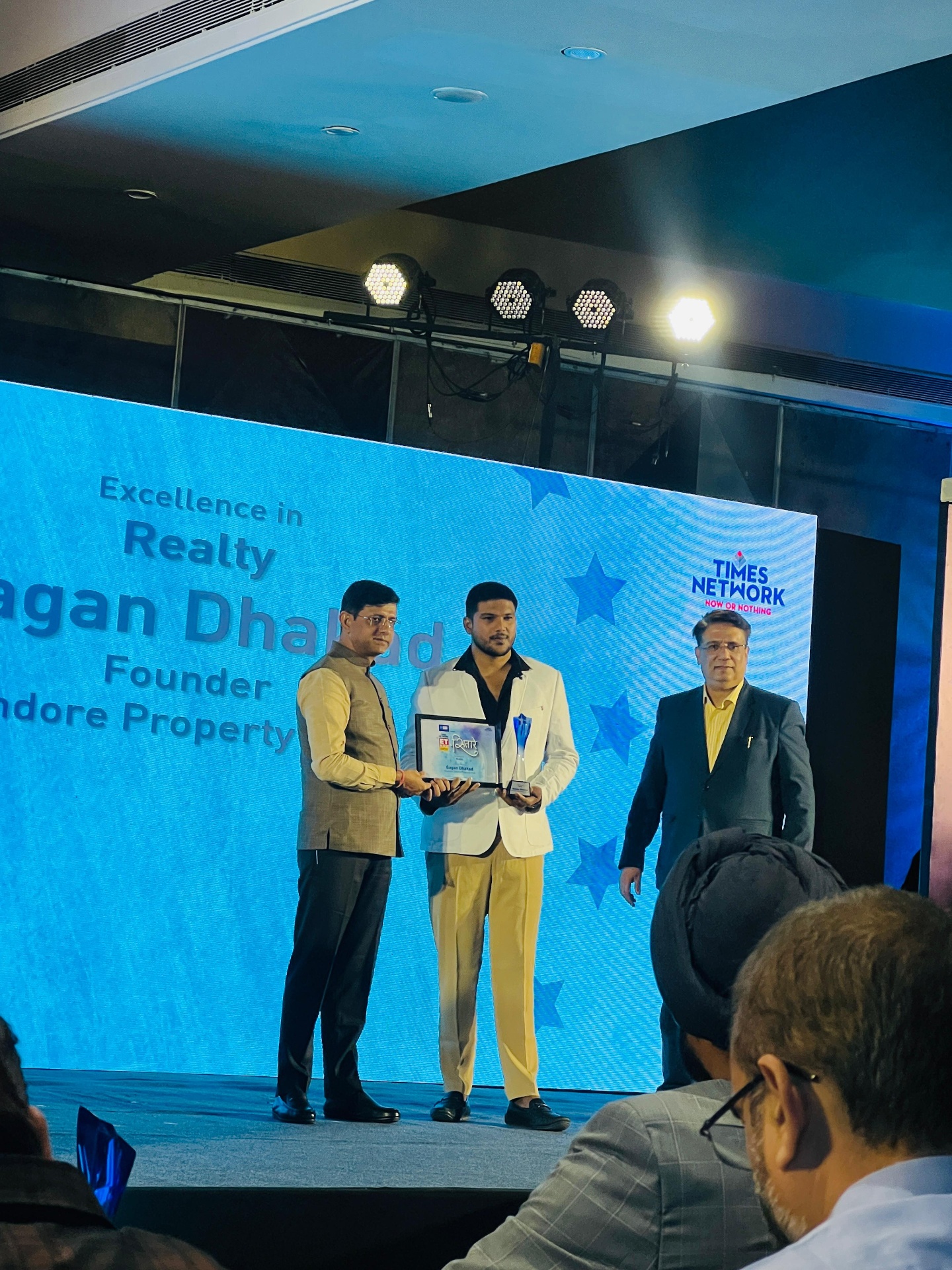 Gagan Dhakad receiving Excellence in Realty award from Times Network